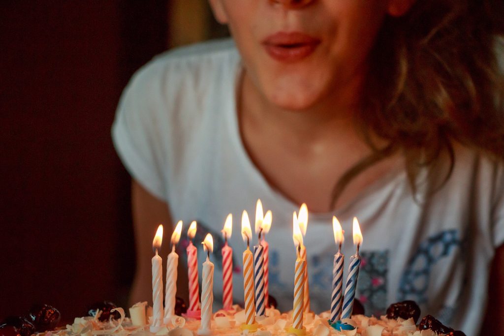 houston donut shop, blowing out candles, birthday donuts